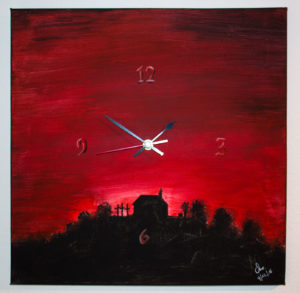 Die Uhr mit dem Motiv vom Kornbühl im späten Sonnenuntergang